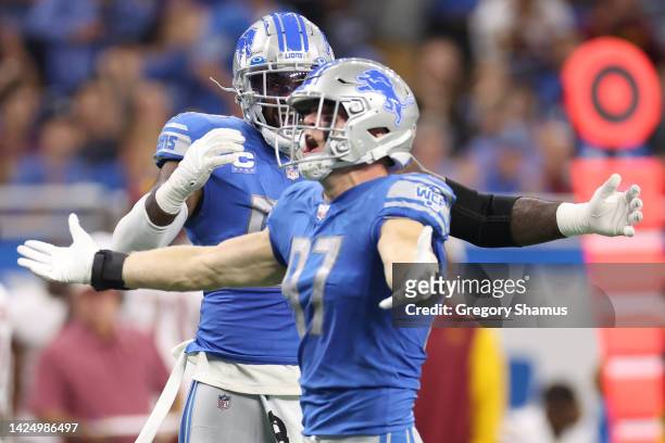Aidan Hutchinson of the Detroit Lions is congratulated by Michael Brockers after making his first career sack during the first quarter of the game...