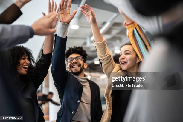 coworkers celebrating at the office - office excitement stock pictures, royalty-free photos & images