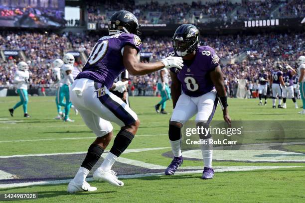 Demarcus Robinson and Lamar Jackson of the Baltimore Ravens celebrate a touchdown in the second quarter against the Miami Dolphins at M&T Bank...