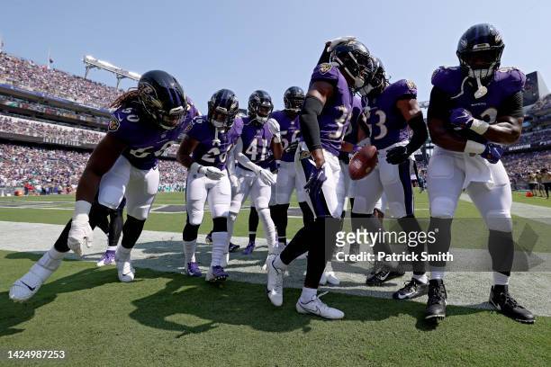 Marcus Williams of the Baltimore Ravens celebrates with teammates after an interception in the first quarter against the Miami Dolphins at M&T Bank...
