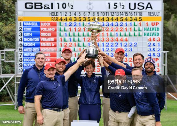 The United States team led by captain Suzy Whaley pose with the PGA Cup trophy after their 15.5 - 10.5 overall match victory after the singles...