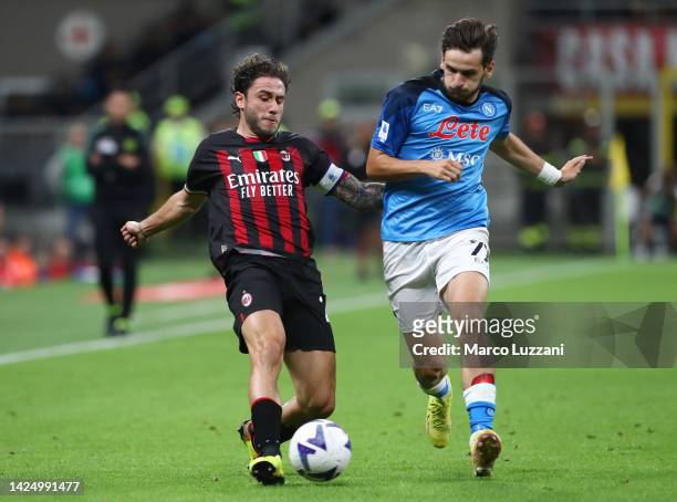 Davide Calabria of AC Milan battles for possession with Khvicha Kvaratskhelia of SSC Napoli during the Serie A match between AC Milan and SSC Napoli...