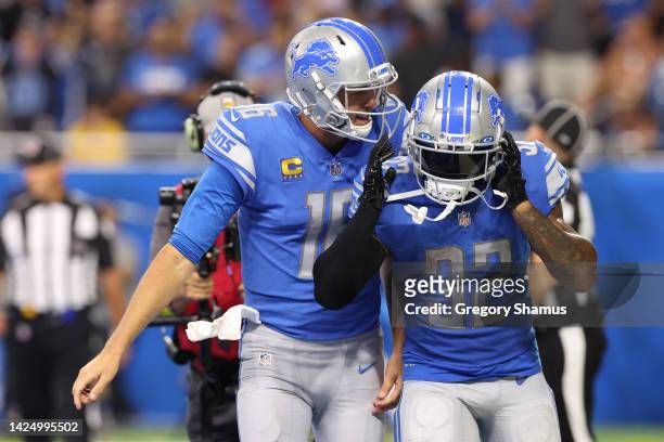 Jared Goff and D'Andre Swift of the Detroit Lions react after a touchdown against the Washington Commanders during the third quarter at Ford Field on...