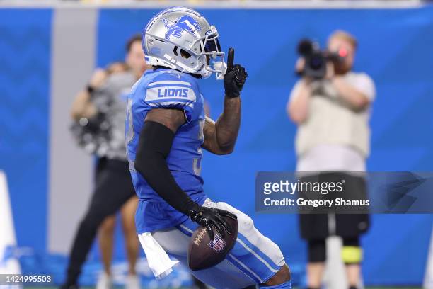 Andre Swift of the Detroit Lions reacts after scoring a touchdown against the Washington Commanders during the third quarter at Ford Field on...