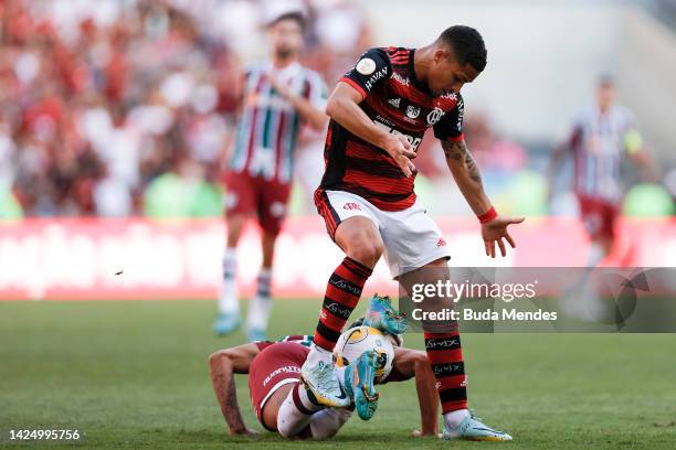 Joao Gomes of Flamengo competes for the ball with Matheus Martins of Fluminense during a match between Flamengo and Fluminense as part of Brasileirao...