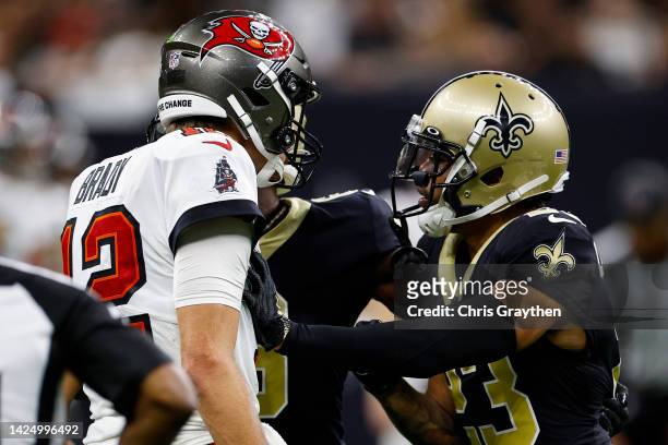 Tom Brady of the Tampa Bay Buccaneers and Marshon Lattimore of the New Orleans Saints argue during the fourth quarter of the game at Caesars...