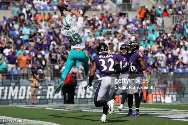 Mike Gesicki of the Miami Dolphins catches a pass for a touchdown in the third quarter against the Baltimore Ravens at M&T Bank Stadium on September...