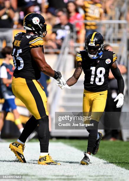 Diontae Johnson of the Pittsburgh Steelers celebrates with Dan Moore Jr. #65 of the Pittsburgh Steelers after a play during the second half in the...