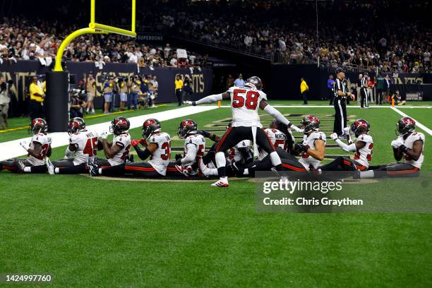 Jamel Dean of the Tampa Bay Buccaneers celebrates with his teammates after an interception in the fourth quarter of the game against the New Orleans...