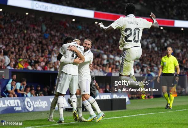 Federico Valverde of Real Madrid celebrates with teammates after scoring their team's second goal during the LaLiga Santander match between Atletico...