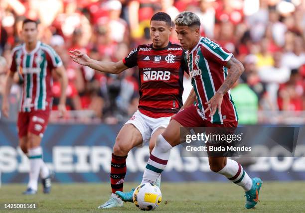 Matheus Martins of Fluminense competes for the ball with Joao Gomes of Flamengo during a match between Flamengo and Fluminense as part of Brasileirao...