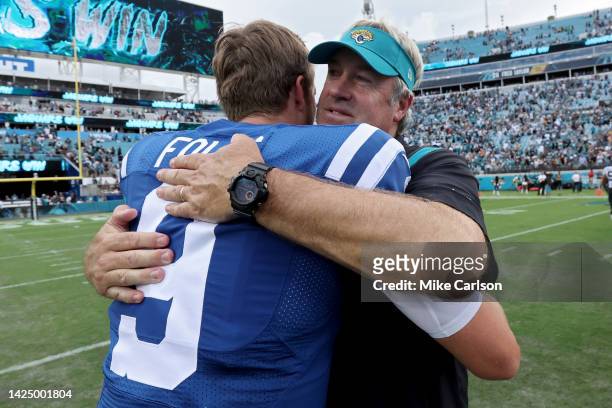 Jacksonville Jaguars head coach Doug Pederson hugs Nick Foles of the Indianapolis Colts after a game at TIAA Bank Field on September 18, 2022 in...