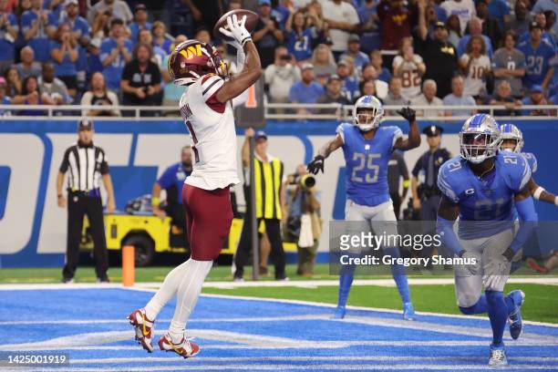 Jahan Dotson of the Washington Commanders makes a catch for a two-point conversion against the Detroit Lions during the fourth quarter at Ford Field...