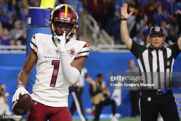 Jahan Dotson of the Washington Commanders reacts after making a catch for a two-point conversion against the Detroit Lions during the fourth quarter...