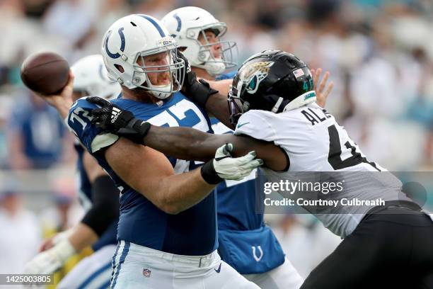 Braden Smith of the Indianapolis Colts defends Josh Allen of the Jacksonville Jaguars in the third quarter at TIAA Bank Field on September 18, 2022...