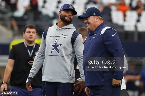 Dak Prescott of the Dallas Cowboys talks with head coach Mike McCarthy before the game against the Cincinnati Bengals at AT&T Stadium on September...