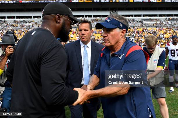 Head coach Mike Tomlin of the Pittsburgh Steelers and head coach Bill Belichick of the New England Patriots embrace after the game at Acrisure...