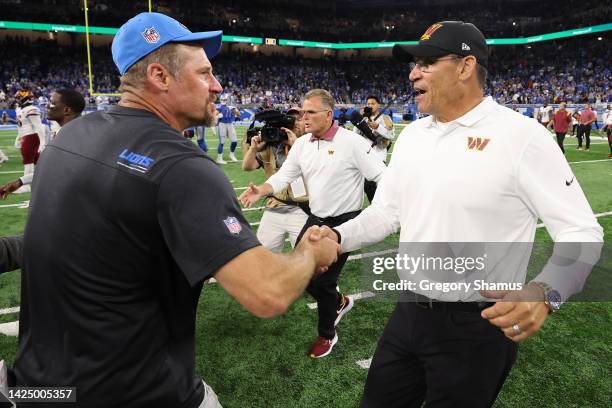 Head coach Dan Campbell of the Detroit Lions and head coach Ron Rivera of the Washington Commanders shake hands after their game at Ford Field on...