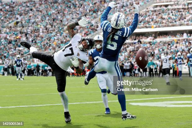 Evan Engram of the Jacksonville Jaguars reaches for a pass in the end zone against Stephon Gilmore of the Indianapolis Colts and in the second half...