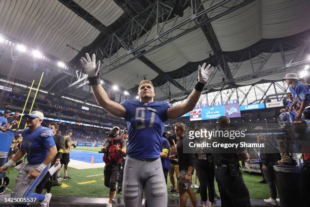 Aidan Hutchinson of the Detroit Lions acknowledges fans a he walks off the field after their 36-27 win against the Washington Commanders at Ford...