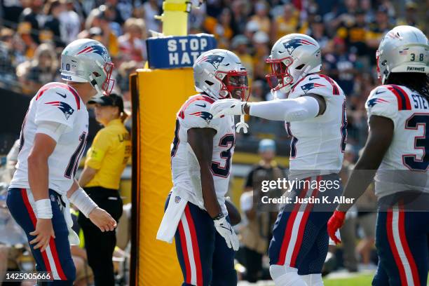 Damien Harris of the New England Patriots celebrates with his team after touchdown during the second half in the game against the Pittsburgh Steelers...