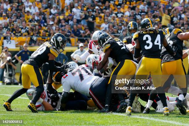 Damien Harris of the New England Patriots runs the ball for a touchdown during the second half in the game against the Pittsburgh Steelers at...