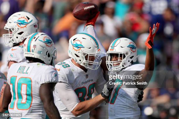Jaylen Waddle of the Miami Dolphins celebrates with teammates after a touchdown in the fourth quarter against the Baltimore Ravens at M&T Bank...