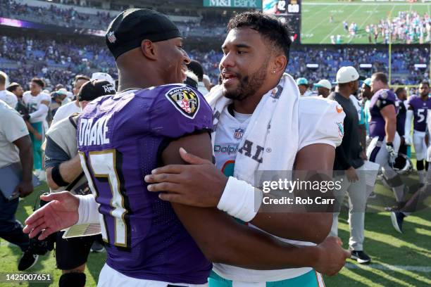 Kenyan Drake of the Baltimore Ravens hugs Tua Tagovailoa of the Miami Dolphins after a game at M&T Bank Stadium on September 18, 2022 in Baltimore,...