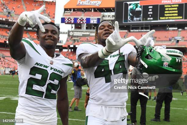 Tony Adams and Jamien Sherwood of the New York Jets react after their 31-30 win against the Cleveland Browns at FirstEnergy Stadium on September 18,...