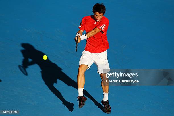 Min-Suk-Young Jeong of Korea plays a backhand in his singles match against Matthew Ebden of Australia on day one of the Davis Cup Asia Oceania Zone...