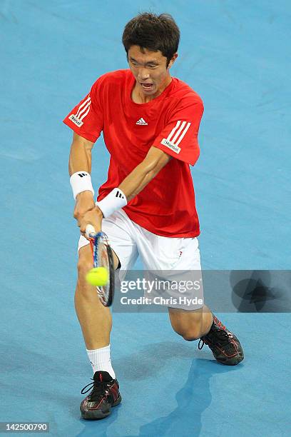 Min-Suk-Young Jeong of Korea plays a backhand in his singles match against Matthew Ebden of Australia on day one of the Davis Cup Asia Oceania Zone...