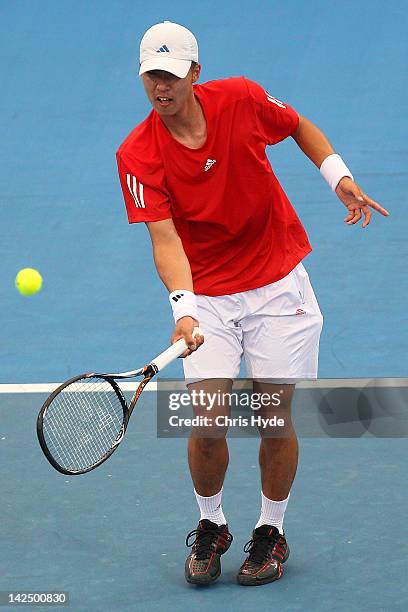 Min-Hyeok Cho of Korea plays a forehand in his singles match against Bernard Tomic of Australia on day one of the Davis Cup Asia Oceania Zone Second...