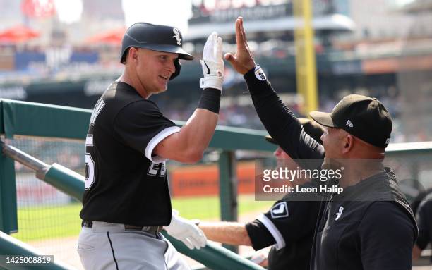 Andrew Vaughn of the Chicago Whites Sox celebrates a fifth-inning grand slam home run with bench coach Miguel Caro during the game against the...