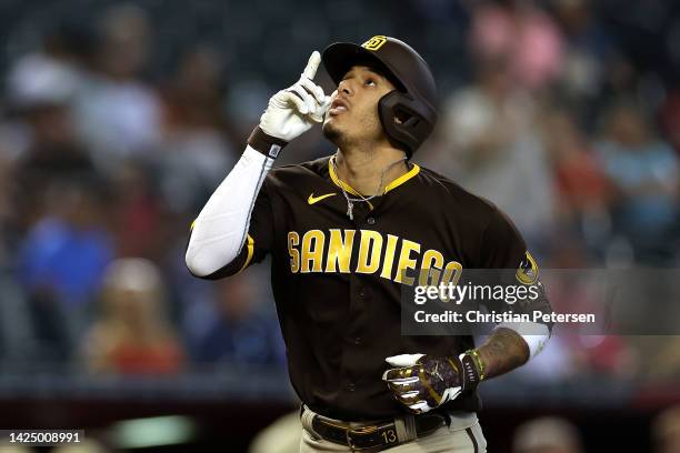 Manny Machado of the San Diego Padres reacts after hitting a two-run home run against the Arizona Diamondbacks during the first inning of the MLB...