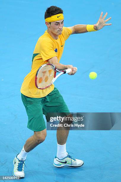 Bernard Tomic of Australia plays a forehand in his singles match against Min-Hyeok Cho of Korea on day one of the Davis Cup Asia Oceania Zone Second...