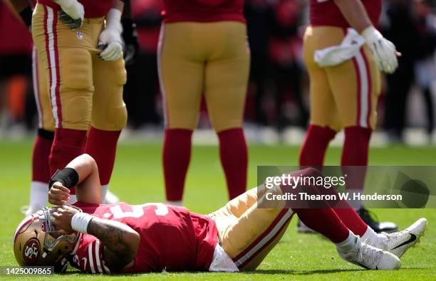 Trey Lance of the San Francisco 49ers reacts after an apparent injury following a play against the Seattle Seahawks at Levi's Stadium on September...