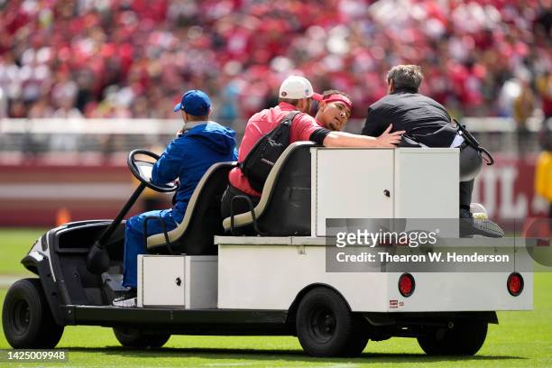 Trey Lance of the San Francisco 49ers reacts as he is carted off the field after an apparent injury following a play against the Seattle Seahawks at...