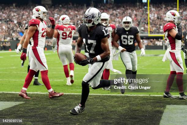 Davante Adams of the Las Vegas Raiders scores a touchdown in the first quarter against the Arizona Cardinals at Allegiant Stadium on September 18,...