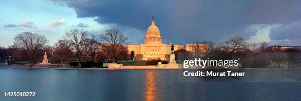 panorama of us capitol building at dusk - washington dc cityscape stock pictures, royalty-free photos & images