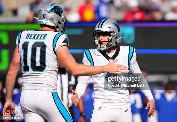 Eddy Pineiro of the Carolina Panthers celebrates with Johnny Hekker of the Carolina Panthers after making a field goal in the fourth quarter of the...