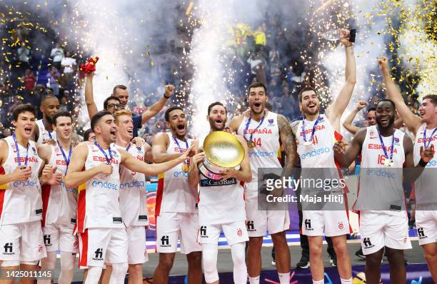 Rudy Fernandez of Spain celebrates with teammates while holding The Nikolai Semashko Trophy on the podium following their victory in the FIBA...