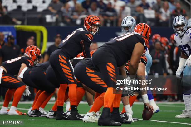 Joe Burrow of the Cincinnati Bengals prepares to snap the ball against the Dallas Cowboys during the first half at AT&T Stadium on September 18, 2022...