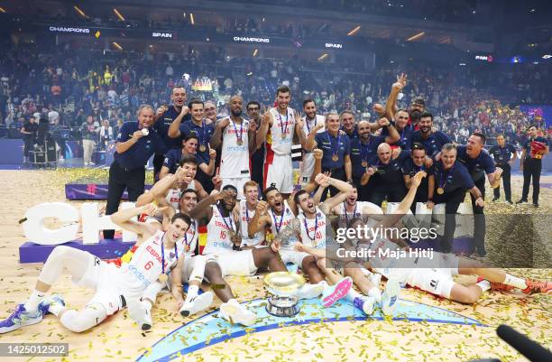 Players and coaching staff of Spain celebrate with their gold medal and The Nikolai Semashko Trophy following their side's victory in the FIBA...