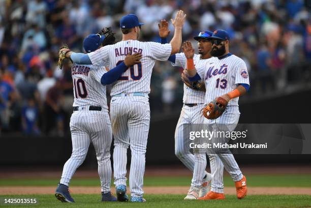 Pete Alonso of the New York Mets celebrates with teammates after defeating the Pittsburgh Pirates at Citi Field on September 18, 2022 in New York...