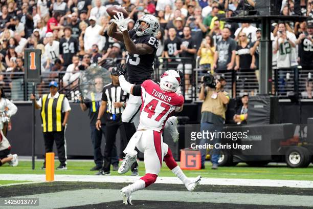 Darren Waller of the Las Vegas Raiders catches a pass against Ezekiel Turner of the Arizona Cardinals for a touchdown in the second quarter at...