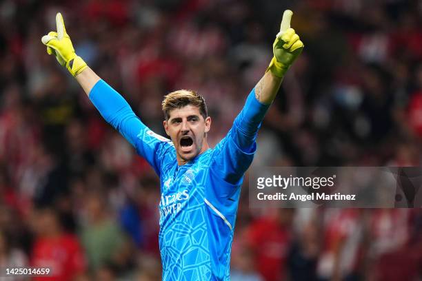 Thibaut Courtois of Real Madrid celebrates following their side's victory in the LaLiga Santander match between Atletico de Madrid and Real Madrid CF...