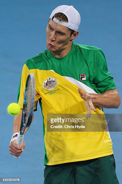 Matthew Ebden of Australia plays a backhand in his singles match against Suk-Young Jeong of Korea on day one of the Davis Cup Asia Oceania Zone...