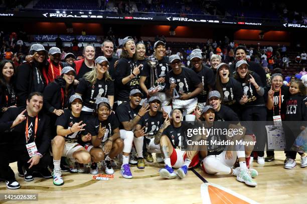 The Las Vegas Aces celebrate with the trophy after defeating the Connecticut Sun 78-71 in game four to win the 2022 WNBA Finals at Mohegan Sun Arena...