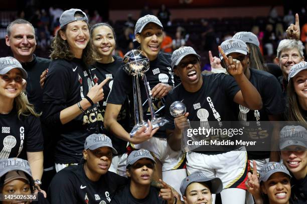 The Las Vegas Aces celebrate with the trophy after defeating the Connecticut Sun 78-71 in game four to win the 2022 WNBA Finals at Mohegan Sun Arena...