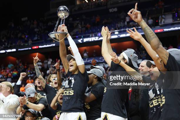 The Las Vegas Aces celebrate with the trophy after defeating the Connecticut Sun 78-71 in game four to win the 2022 WNBA Finals at Mohegan Sun Arena...